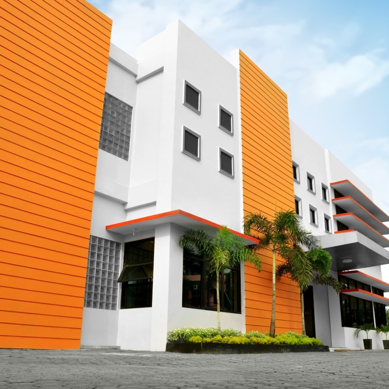 Stylized modern office building with parking lot in front of it